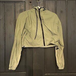 Cropped green rain jacket